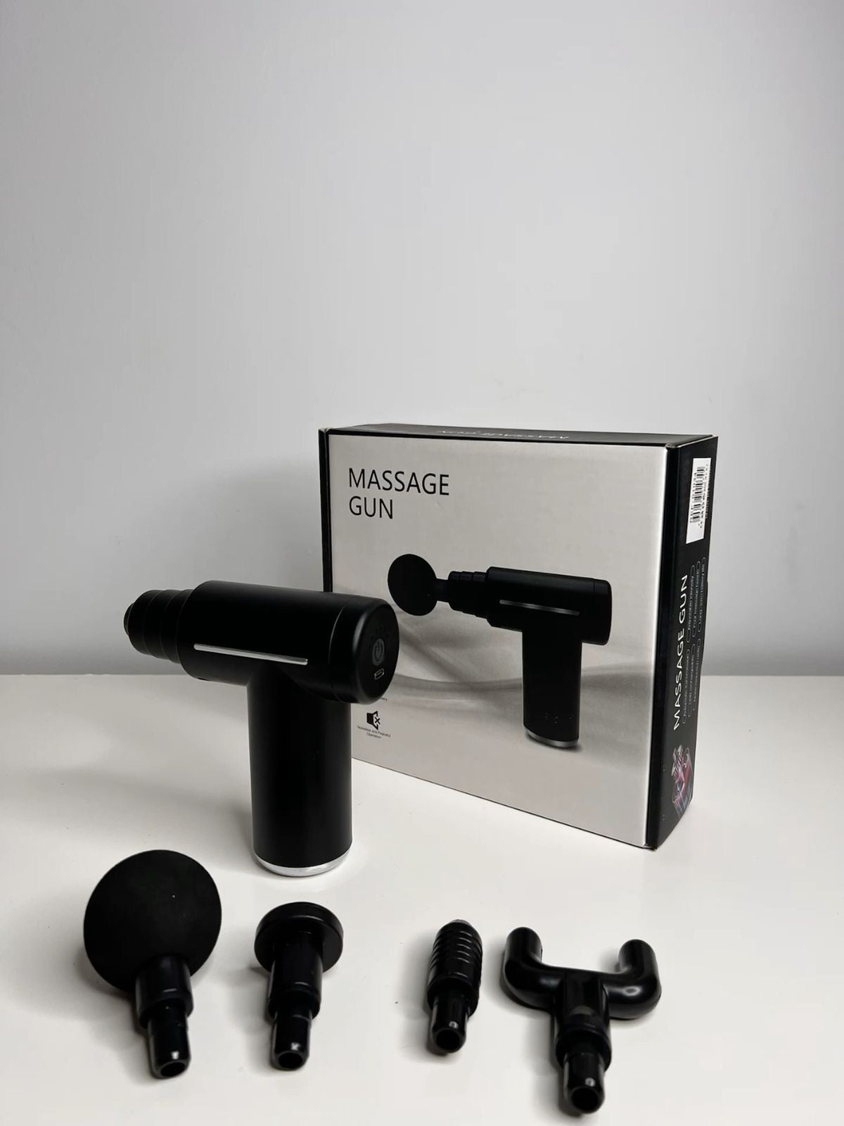 Pistola de masaje muscular